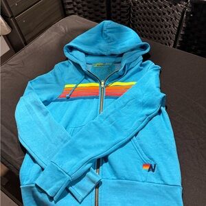 Aviator Nation Blue Zip-Up Sweater with Rainbow Stripes